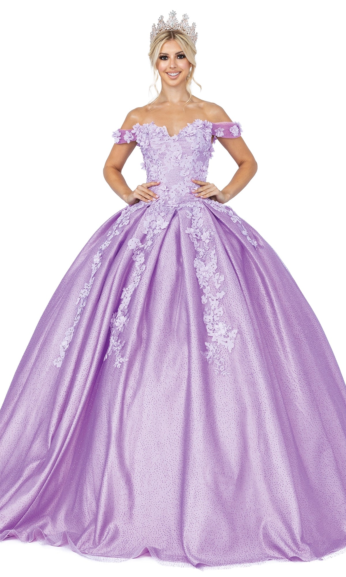 A woman wearing the Quinceanera Dress 1501 by Dancing Queen—a lavender, off-the-shoulder A-line ball gown with a sweetheart neckline and floral appliques—stands against a white background, accessorized with a tiara.